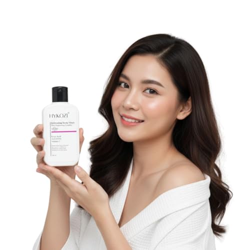 Woman holding a bottle of HYKOZI brightening body wash on a white background